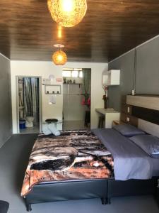 Voodi või voodid majutusasutuse Makana apartastudio toas