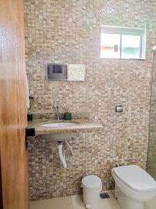 Uma casa de banho em Hostel Network - Quartos Privativos