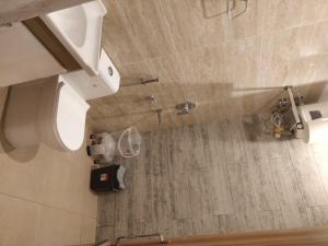 a bathroom with a sink and a toilet at Pinnacle Vesta Botique Stay in Mussoorie