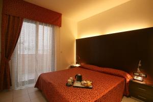 Posteľ alebo postele v izbe v ubytovaní Residence Domus