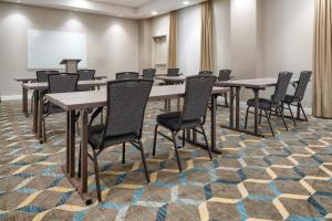 a conference room with tables and chairs on a carpet at Residence Inn by Marriott Decatur Emory Area in Decatur