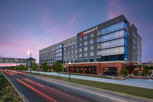 a building with a sign on the side of a street at UNC Charlotte Marriott Hotel & Conference Center in Charlotte