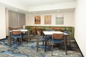 a dining room with tables and chairs at Fairfield Inn by Marriott North Little Rock in North Little Rock