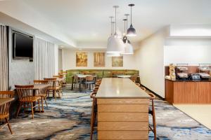 a restaurant with tables and chairs and a dining room at Fairfield Inn by Marriott North Little Rock in North Little Rock