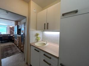 a kitchen with a sink and a counter top at Ferienwohnung Brigitte in Füssen