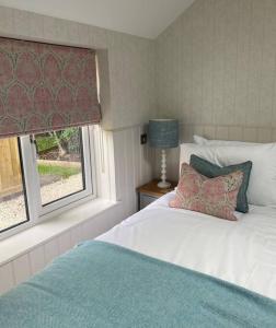 Ένα ή περισσότερα κρεβάτια σε δωμάτιο στο Hillview Cottage