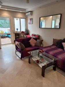 a living room with a couch and a table at Star Studio Gauthier in Casablanca