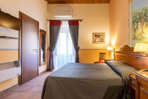 Letto o letti in una camera di Hotel Il Barocco