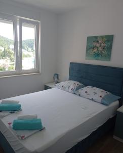 Postel nebo postele na pokoji v ubytování Apartman Nimfa Živogošće