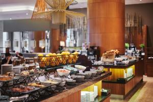 a buffet line with food on display in a restaurant at The Westin Warsaw in Warsaw