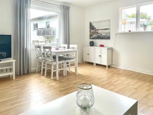 a living room with a table and a dining room at 4 person holiday home in TRENSUM-By Traum in Trensum