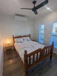 a bedroom with a bed and a ceiling fan at Entire House near Brisbane City 2Beds in Brisbane