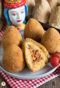 a plate with some food on a table at A Casa Di Alex in Catania +19 photos