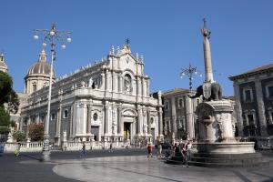 a large building with a fountain in front of it at A Casa Di Alex in Catania