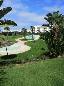 a view of a park with a swimming pool at TAMARIs in Tamaris