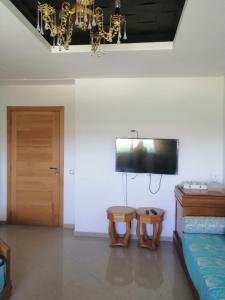 a living room with a couch and a tv at TAMARIs in Tamaris