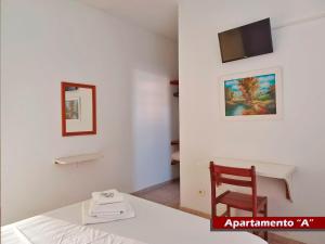 TV a/nebo společenská místnost v ubytování Rial Hotel