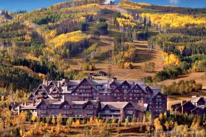 a large house on the side of a mountain at The Ritz-Carlton, Bachelor Gulch in Beaver Creek