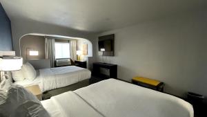 a hotel room with two beds and a window at Comfort Suites Denver North - Westminster in Westminster