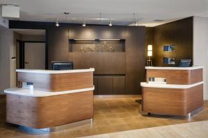 a lobby with two reception desks in a building at Courtyard by Marriott Henderson - Green Valley - Las Vegas in Las Vegas