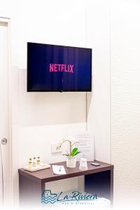 TV a/nebo společenská místnost v ubytování La Riviera