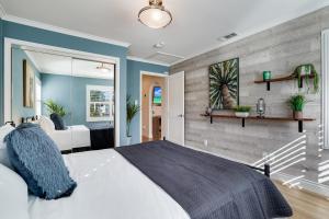 a bedroom with a white bed and blue walls at Relax in a Gorgeous 6 Person Quaint Home in San Jose