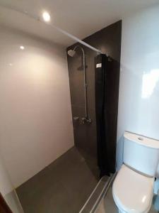 a bathroom with a toilet and a shower at Northbeach, Pinamar in Costa Esmeralda