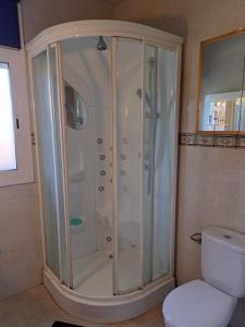 a shower in a bathroom with a toilet at Villa LLoret Blau in Lloret de Mar