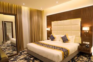 Letto o letti in una camera di Oriens Hotel