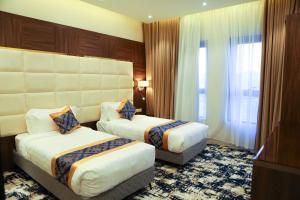 Letto o letti in una camera di Oriens Hotel