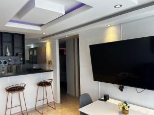 A television and/or entertainment centre at Serenity Cerca CC Los Mayales