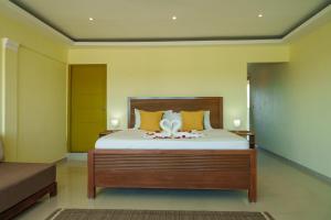a bedroom with a bed with a flower on it at Beautiful Three Storage House Near Playa Caleta in La Romana