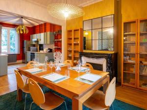 a dining room with a table and chairs and a fireplace at Gîte Nancy, 4 pièces, 6 personnes - FR-1-584-294 in Nancy