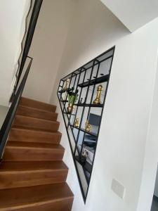a stairwell with a glass shelf on the wall at best apartment in buhcman (shivtie Israel 26) in Modi'in