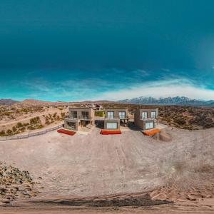a house in the middle of the desert at Reflejo del Lago - Cabañas frente al Dique Potrerillos in Ciudad Lujan de Cuyo