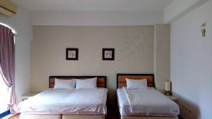 Voodi või voodid majutusasutuse Fuyue Sea View B&B toas
