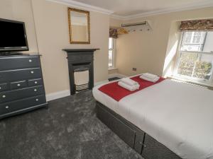 Postel nebo postele na pokoji v ubytování Trevor Cottage