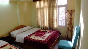 Postel nebo postele na pokoji v ubytování Hotel Dolphin