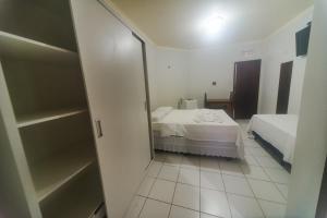 Postel nebo postele na pokoji v ubytování Pousada Clube Vista do Rio