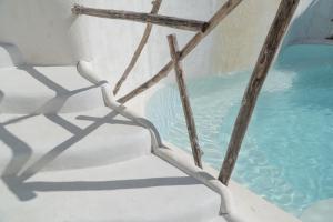 a metal stairway leading to a pool of water at Gravity Eco Boutique Hotel - Adults Only in Uluwatu