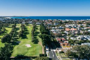 an aerial view of a golf course with houses at Kurranulla Sapphire - U3 in Cronulla