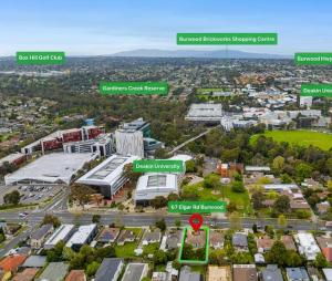 an aerial view of a city with a parking lot at Elgar 67 in Burwood