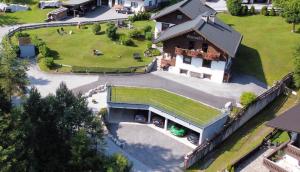 an overhead view of a house with a yard at Haus Almrausch in Seefeld in Tirol