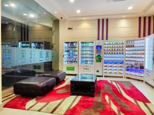 a room with a lot of bottles of water at Hotel 98 in Kuching