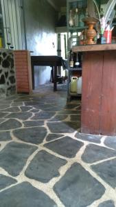 a room with a table and a stone floor at Osu Lena Habaraduwa in Habaraduwa +19 photos