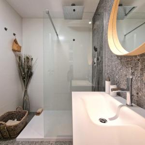 a bathroom with a sink and a shower at APARTMAN LORINČIK KOSICE in Košice