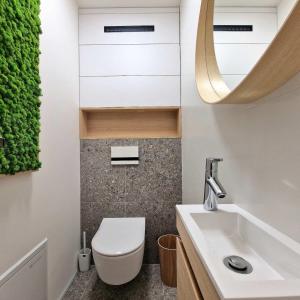 a bathroom with a toilet and a sink at APARTMAN LORINČIK KOSICE in Košice