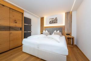 Tempat tidur dalam kamar di Vitalhotel Sonnenhof