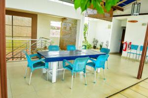 a blue table and chairs in a room at Blackberry villa in Colombo