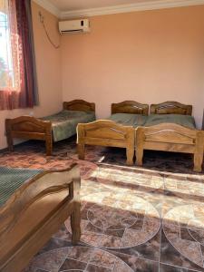 a room with three beds in a room at Hotel Kobuleti in K'obulet'i